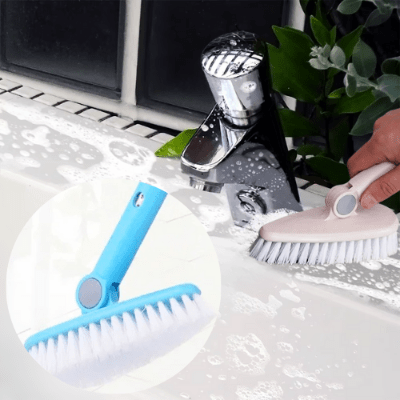 elle nettoie lavabo avec balai brosse