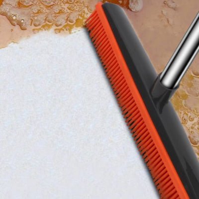 nettoyer saleté avec balai caoutchouc rouge